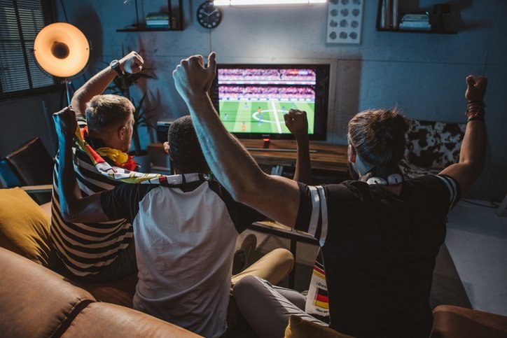 Did Americans watch sporting events at home, in person, or at the bar in 2024?